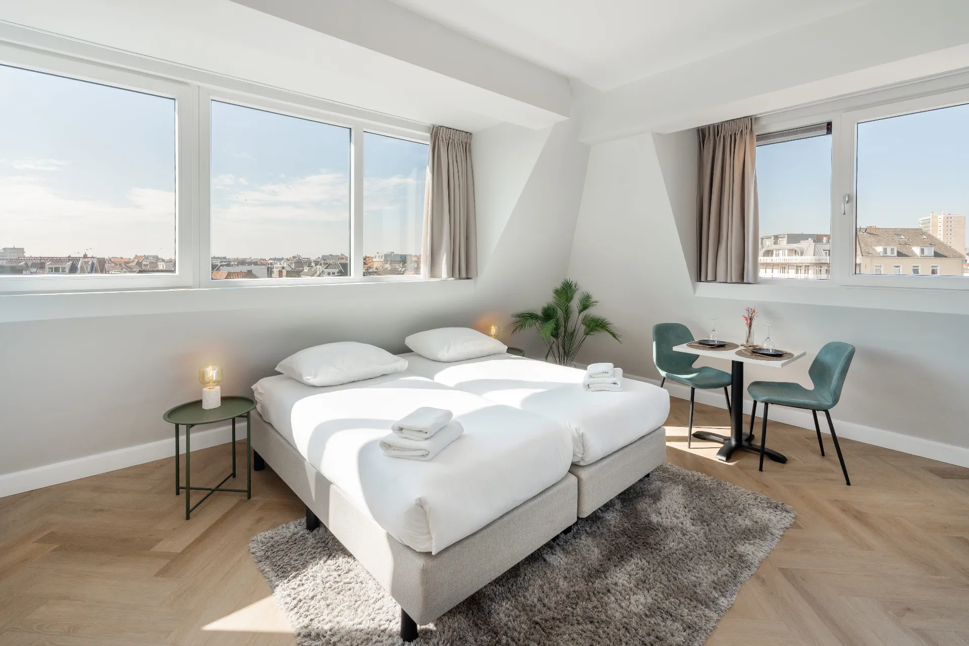 Top-floor twin room with street view at Ocean House Zandvoort, with views over the village rooftops